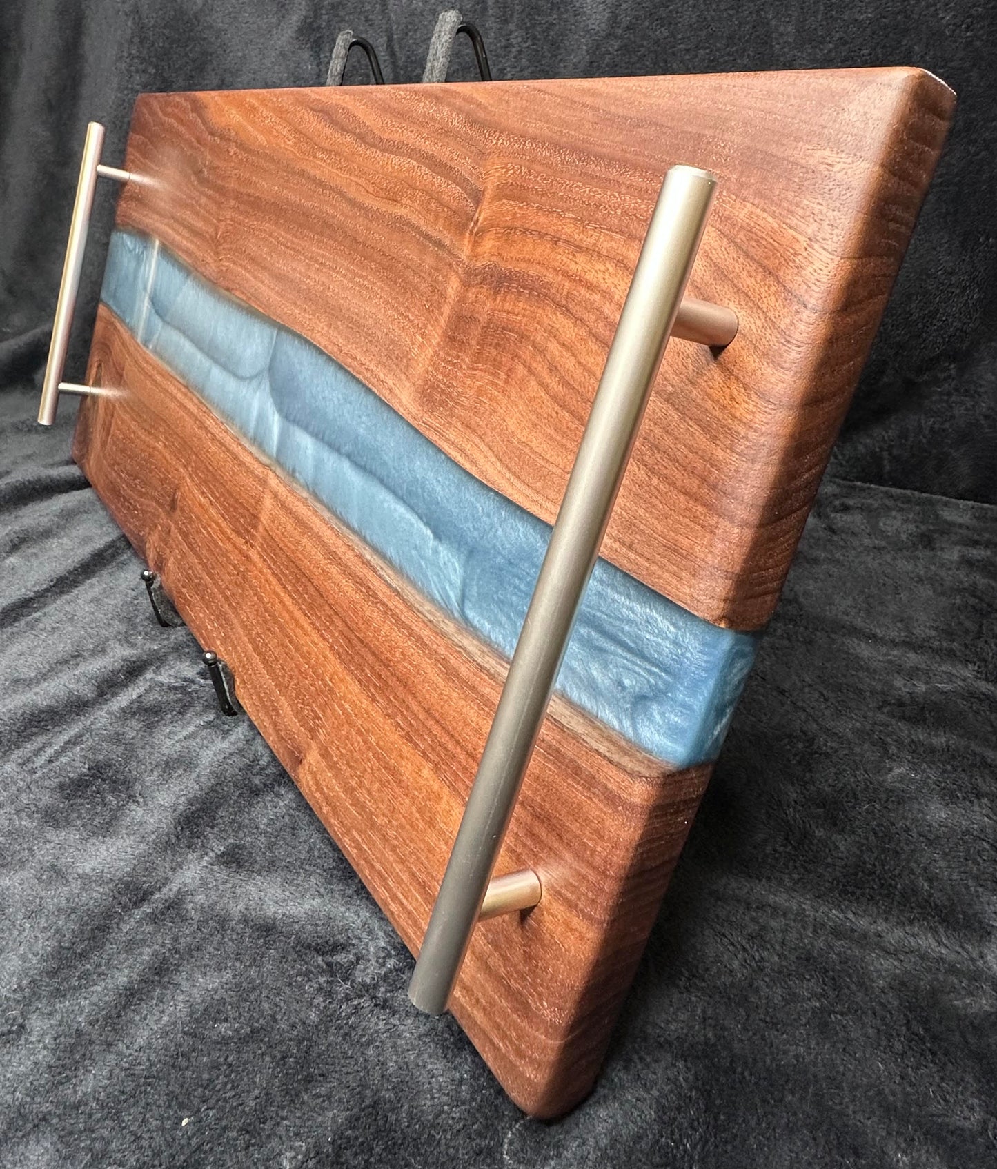 107 - Black Walnut with Silver Blue Epoxy River and Brushed Stainless Handles Charcuterie Board