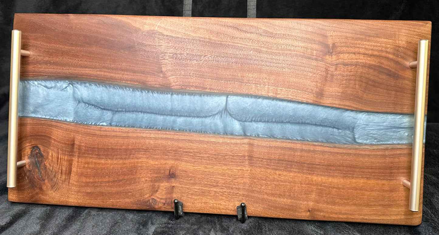 107 - Black Walnut with Silver Blue Epoxy River and Brushed Stainless Handles Charcuterie Board
